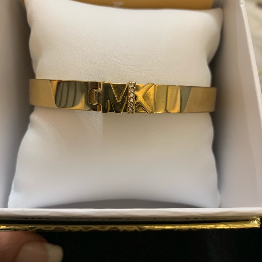 MK bangle with the MK initials, gold very stylish I just don’t wear Gold